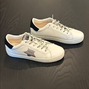 Vintage Havana White and Black Athletic Shoes featuring a silver star
